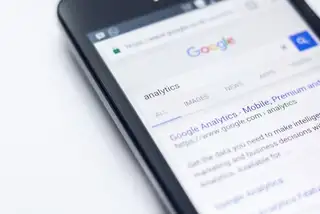 A mobile phone screen with google search engine page