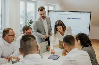 team meeting around a desk 